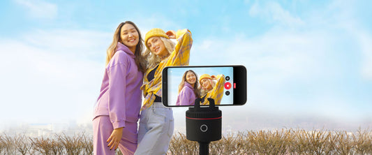 Two creators recording outdoors with a smartphone mounted on a Pivo Pod