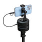Portable power bank fast charger with dual USB ports charging a smartphone on a stand